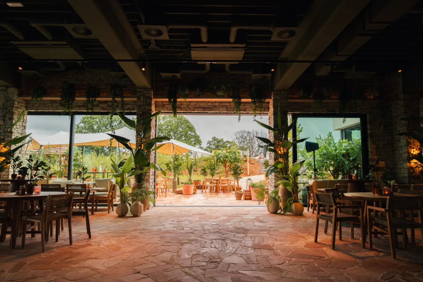 The hotel’s Surf Restaurant opening onto a green garden terrace