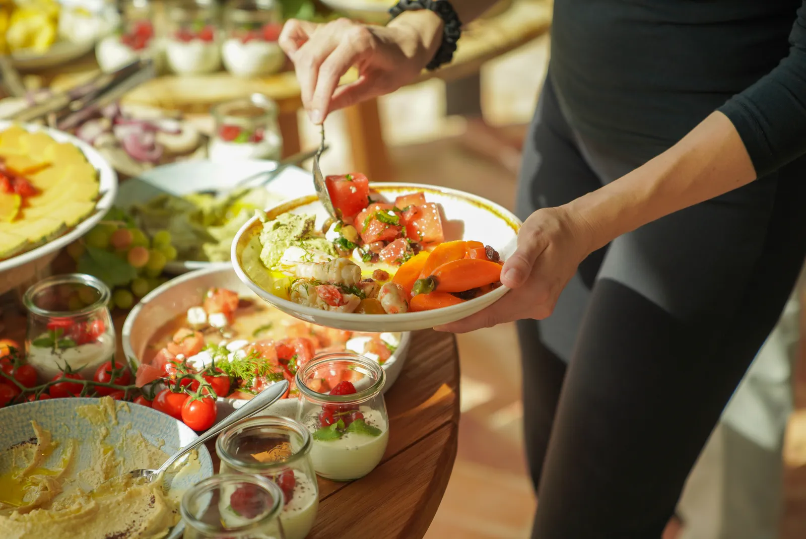 A plate being filled at the lunch buffet